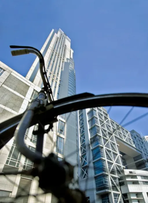 Framed Print : Bicycle parked in front of the modern architecture of the Shanghai Stock Exchange in the Pudong Lujiazui Financial District, Shanghai Framed Print : Bicycle parked in front of the modern architecture of the Shanghai Stock Exchange in the Pudong Lujiazui Financial District, Shanghai