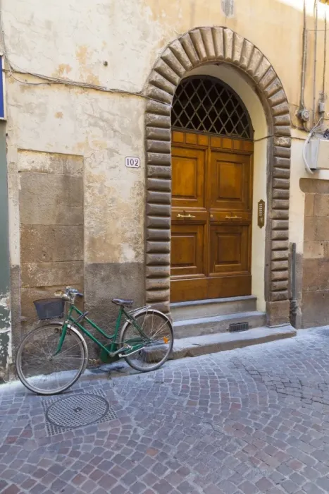 Framed Print : Bicycle parked outside front door, Lucca, Tuscany, Italy, Europe Framed Print : Bicycle parked outside front door, Lucca, Tuscany, Italy, Europe