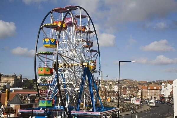 Big ferris wheel in Luna Park Amusements funfair by harbour, Scarborough