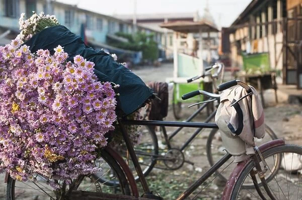 A bike loaded with fresh flowers at the flower market in Mandalay, Myanmar (Burma), Asia