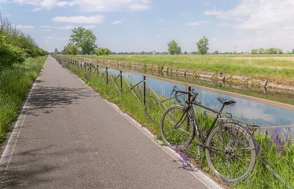 A bike on the rail of the Naviglio Pavense canal which links Milan to Pavia which