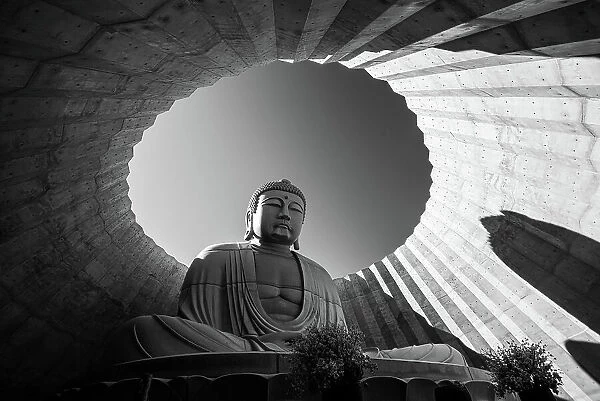 Black and White of a Buddha statue framed in circular architecture, Hill of the Buddha, Sapporo, Hokkaido, Japan, Asia