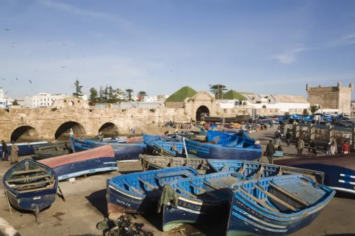 Framed Print : Blue boats in fishing port outside fortified town walls on west coast, Essaouira Framed Print : Blue boats in fishing port outside fortified town walls on west coast, Essaouira