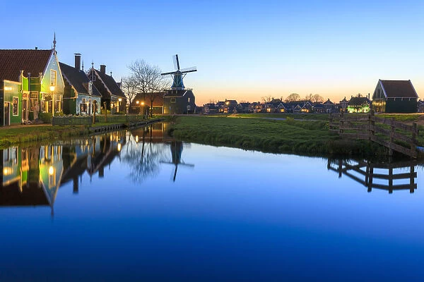 Blue lights at dusk on wooden houses and windmills of the typical village of Zaanse Schans