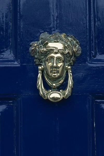 Blue painted door and knocker in the centre of the city of Dublin