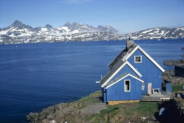Blue painted wooden house on the coast