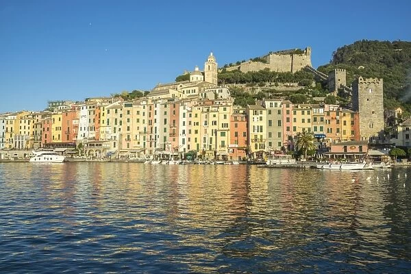 The blue sea frames the typical colored houses of Portovenere, UNESCO World Heritage Site