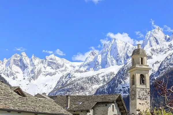 Blue sky in spring on bell tower and stone roofs, Soglio, Maloja, Bregaglia Valley