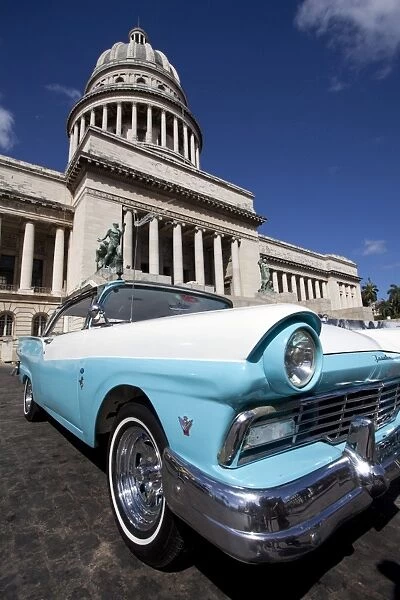 Blue vintage American car parked opposite The Capitolio, Havana Centro, Havana, Cuba, West Indies, Central America