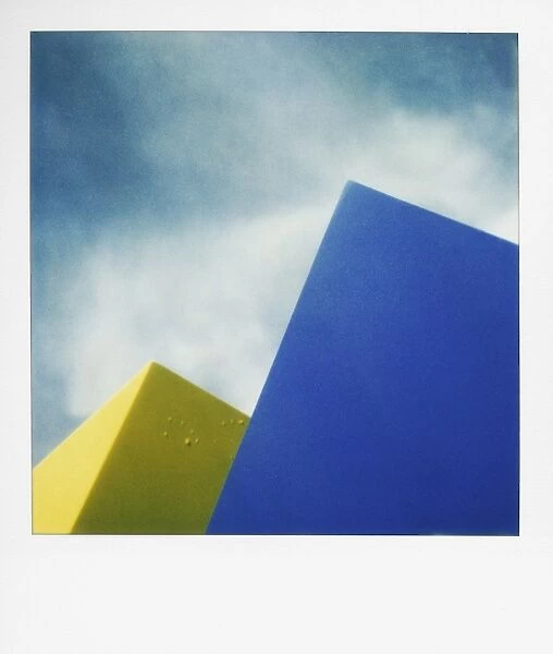 Blue and yellow shapes against sky