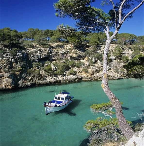 Boat anchored in rocky inlet, Cala Pi, Mallorca, Balearic Islands, Spain, Mediterranean