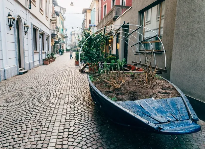 Framed Print : A boat filled with plants on a street in Stresa, Piedmont, Italy, Europe Framed Print : A boat filled with plants on a street in Stresa, Piedmont, Italy, Europe