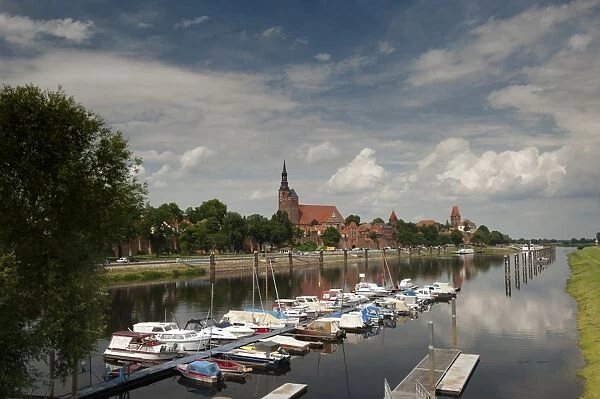 Boat harbour on the Elbe River below walls of historical town of Tangermunde