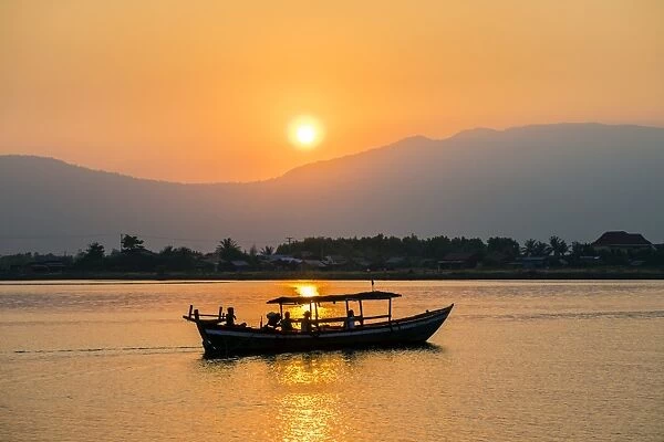 Boat on the Kampot River at sunset, Kampot, Kampot Province, Cambodia, Indochina