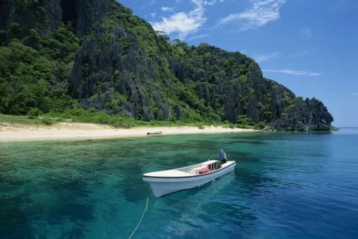 Framed Print : Boat moored off a secluded beach on Coron Island Framed Print : Boat moored off a secluded beach on Coron Island