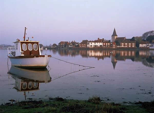 Boat moored in tidal creek, Bosham village, West Sussex, England, United Kingdom, Europe