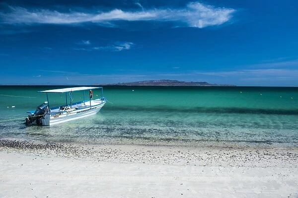 Boat on Playa Tecolote with Isla Espiritu Santo in the background, Baja California, Mexico, North America