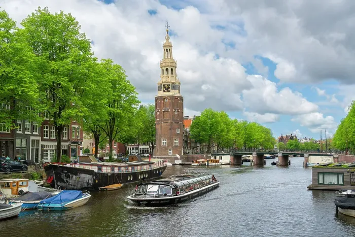 Framed Print : Boat on Rapenburgwal canal and Montelbaanstoren tower in the background, Amsterdam, The Netherlands, Europe Framed Print : Boat on Rapenburgwal canal and Montelbaanstoren tower in the background, Amsterdam, The Netherlands, Europe
