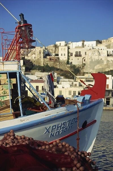 Boat and village, Naxos, Cyclades, Greek Islands, Greece, Europe