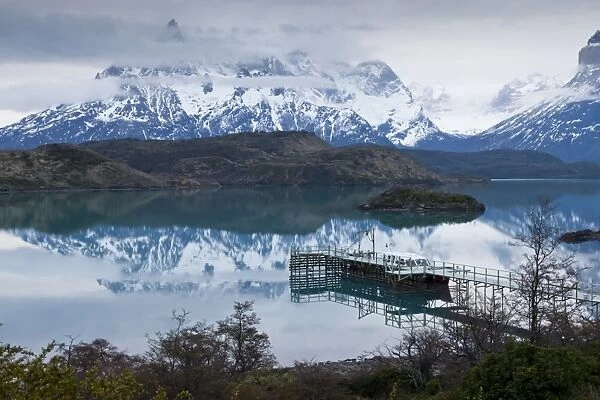 Boatdock and late evenng reflections in Lago Pehoe, Torres del Paine National Park, Patagonia, Chile, South America