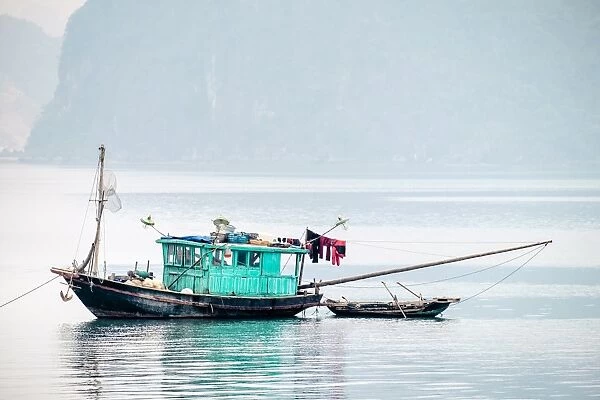 Boats in Ha Long bay on a foggy morning, Quang Ninh Province, Vietnam, Indochina