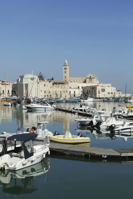 Framed Print : Boats in the harbour by the cathedral of St. Nicholas the Pilgrim (San Nicola Pellegrino) in Trani