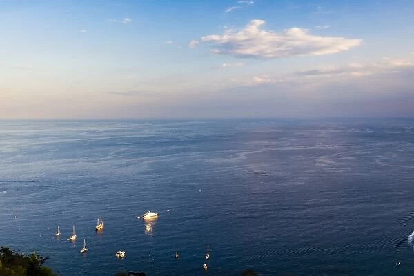 Boats on the Ionian Sea, part of the Mediterranean Sea at sunset, Taormina, East Coast of Sicily, Italy, Mediterranean, Europe