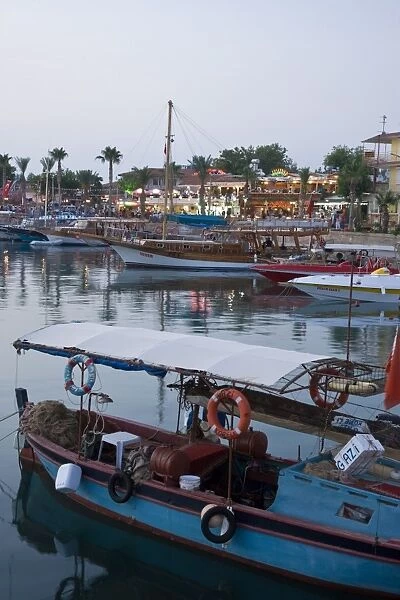 Boats lining the harbourside in Side, Mediterranean coast, Anatolia, Turkey