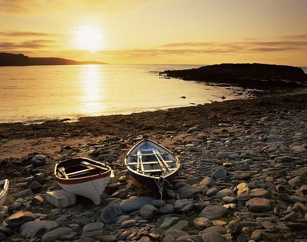 Boats on Norwick beach at sunrise