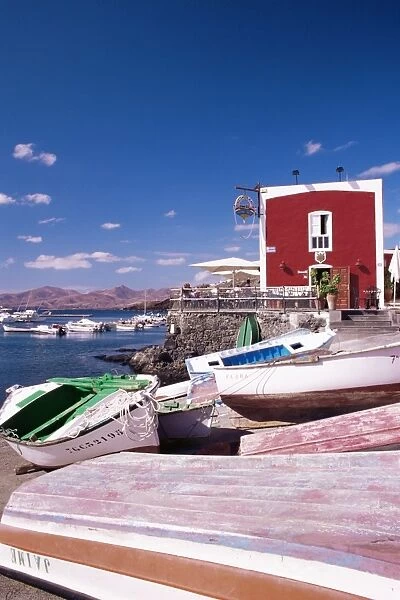 Boats and old red house in the old harbour, Puerto del Carmen, Lanzarote