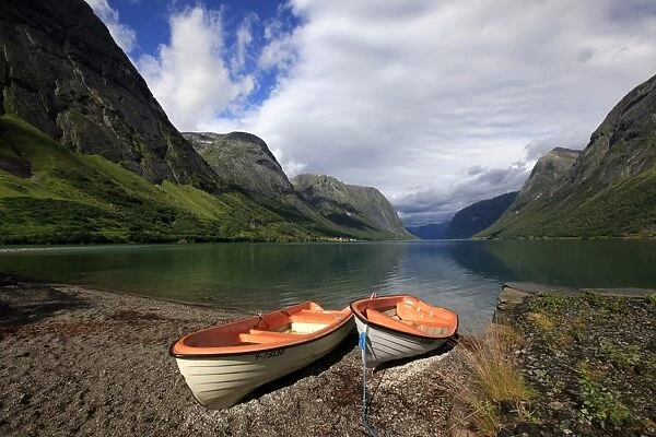 Boats pulled up by a fjord, Songdal region, near Bergen, western Norway, Scandinavia, Europe