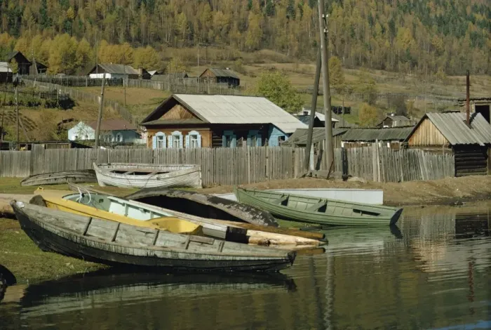 Framed Print : Boats pulled out of water and wooden houses Framed Print : Boats pulled out of water and wooden houses