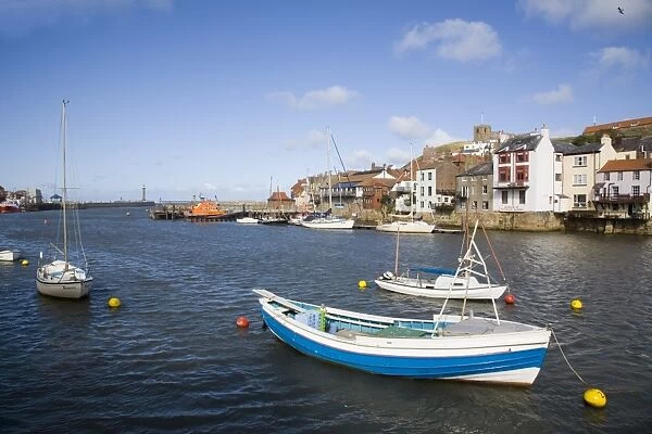 Boats in River Esk harbour and quayside buildings of old town, Whitby, Heritage Coast of North East England, North Yorkshire, England, United