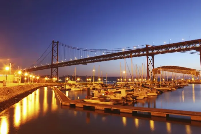 Framed Print : Boats on the River Tagus move at night in the Doca de Santa Amaro marina under the 25 April Bridge, Lisbon, Portugal, Europe Framed Print : Boats on the River Tagus move at night in the Doca de Santa Amaro marina under the 25 April Bridge, Lisbon, Portugal, Europe
