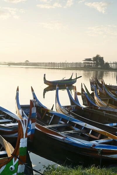 Boats on the Taungthaman Lake near Amarapura with the U Bein teak bridge behind, Mandalay