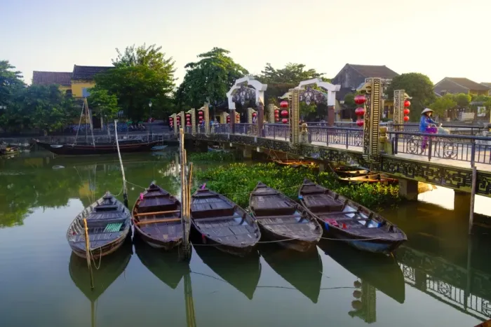Framed Print : Boats on the Thu Bon River with a cyclist on the Lantern Bridge in Hoi An, UNESCO Framed Print : Boats on the Thu Bon River with a cyclist on the Lantern Bridge in Hoi An, UNESCO