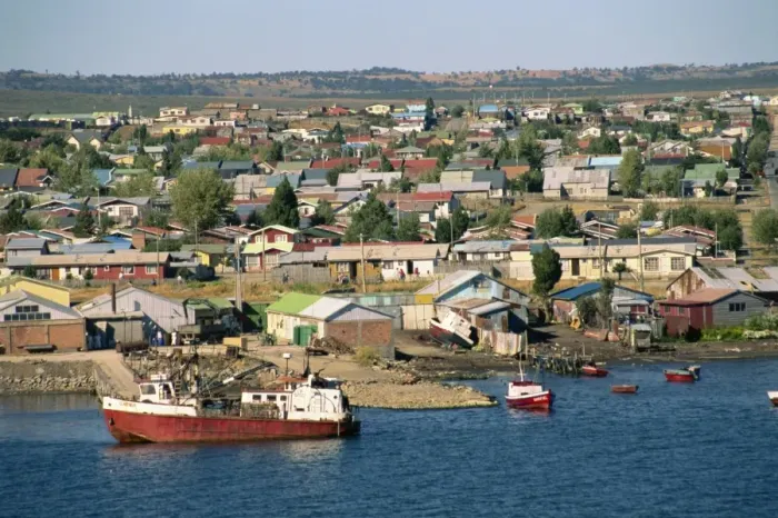 Framed Print : Boats on the waterfront and the town of Puerto Natales, in Magallanes, Chile Framed Print : Boats on the waterfront and the town of Puerto Natales, in Magallanes, Chile