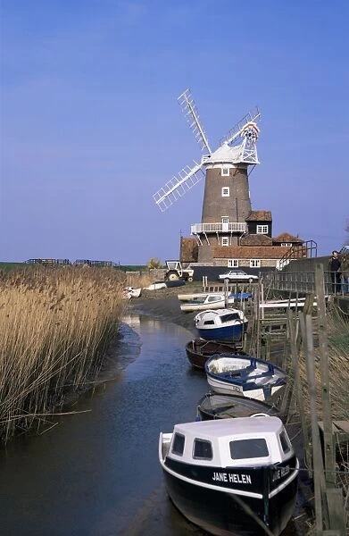 Boats on waterway and windmill, Cley next the Sea, Norfolk, England, United Kingdom