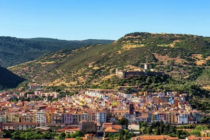 Framed Print : Bosa colorful city with castle on top of the hill seen from outside of the city, Bosa, Sardinia, Italy, Mediterranean, Europe Framed Print : Bosa colorful city with castle on top of the hill seen from outside of the city, Bosa, Sardinia, Italy, Mediterranean, Europe