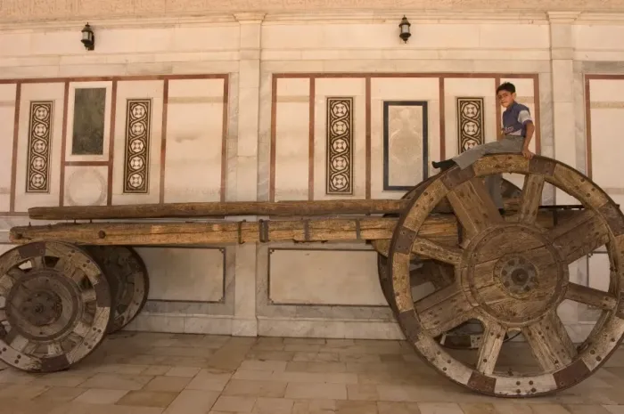 Framed Print : Boy on top of big wheeled cart Framed Print : Boy on top of big wheeled cart