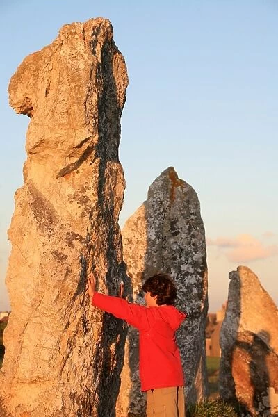 Boy with menhir, Camaret-sur-Mer, Finistere, Brittany, France, Europe