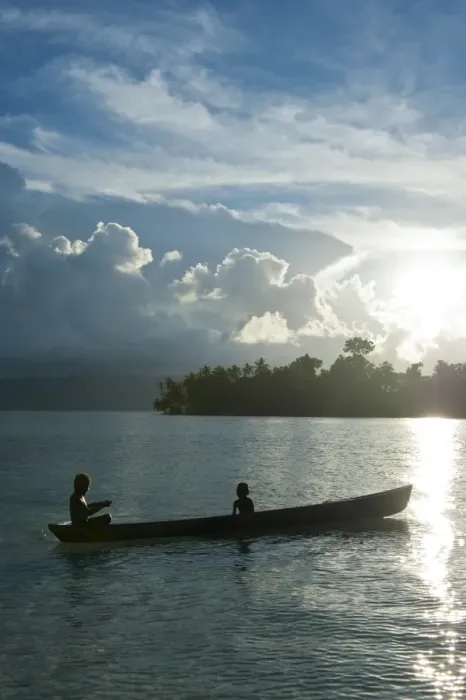 Framed Print : Boys in a canoe in backlit in the Marovo Lagoon, Solomon Islands, Pacific Framed Print : Boys in a canoe in backlit in the Marovo Lagoon, Solomon Islands, Pacific