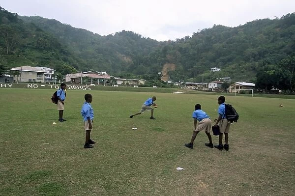 Boys playing cricket at Charlotteville