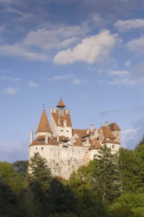 Framed Print : Bran Castle (Draculas Castle) perched atop a 60m peak in the centre of the village Framed Print : Bran Castle (Draculas Castle) perched atop a 60m peak in the centre of the village