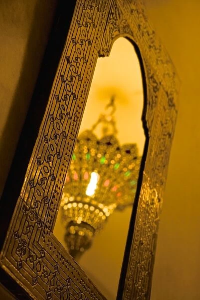 Brass ceiling lamp, reflected in typical mirror, Marrakech, Morocco, North Africa, Africa