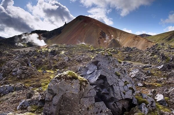 Brennisteinsalda, 855 m, Icelands most colourful mountain, dominates the lava fields of Laugahraun, Landmannalaugar area, Fjallabak region, Iceland