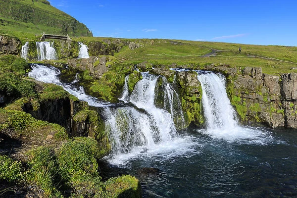 Bridge and Kirkjufellsfoss Waterfall, tourist, Grundarfjordur, blue sky, good Summer weather