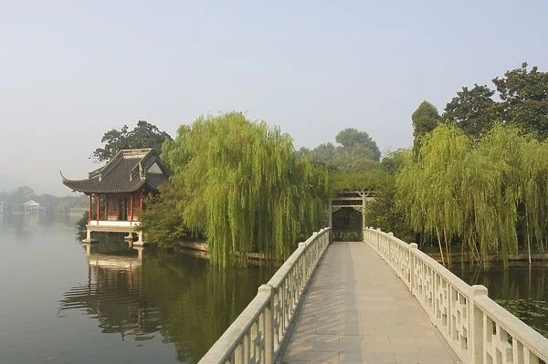 Bridge and pavilion, West Lake, Hangzhou, Zhejiang Province, China, Asia