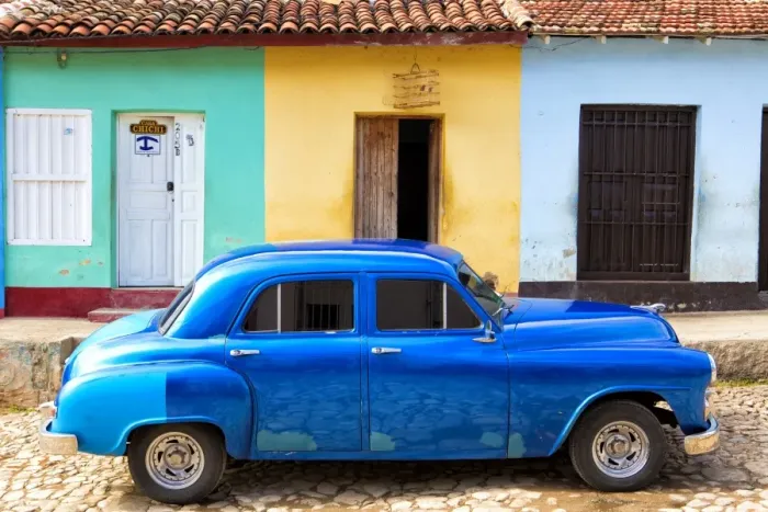 Framed Print : Bright blue vintage American car parked in front of colourful painted colonial houses, Trinidad, UNESCO World Heritage Site, Cuba, West Indies, Central America Framed Print : Bright blue vintage American car parked in front of colourful painted colonial houses, Trinidad, UNESCO World Heritage Site, Cuba, West Indies, Central America
