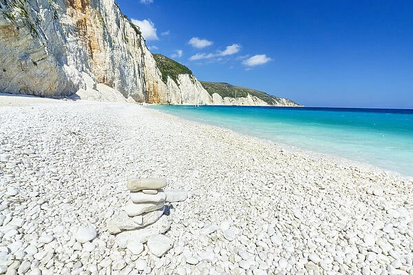 Bright sun on white pebbles of Fteri Beach washed by the turquoise sea, Kefalonia, Ionian Islands, Greek Islands, Greece, Europe